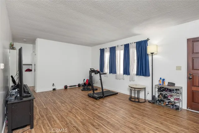 a bed room with a bed and a television