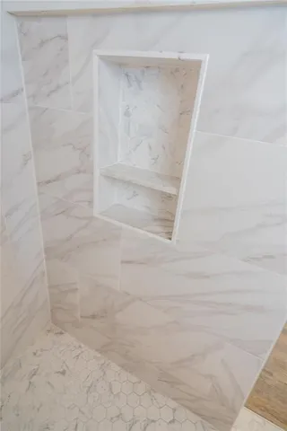 a view of hallway with wooden floor