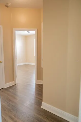 a view of a small space with wooden floor