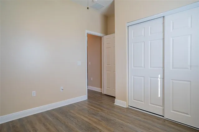 a view of kitchen with cabinets and wooden floor
