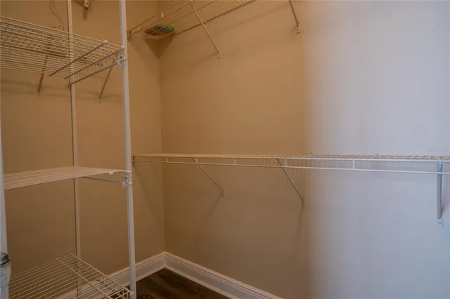 a kitchen with stainless steel appliances granite countertop a sink a stove and cabinets