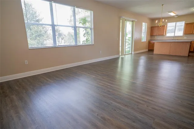 a view of a chair and table in the garden