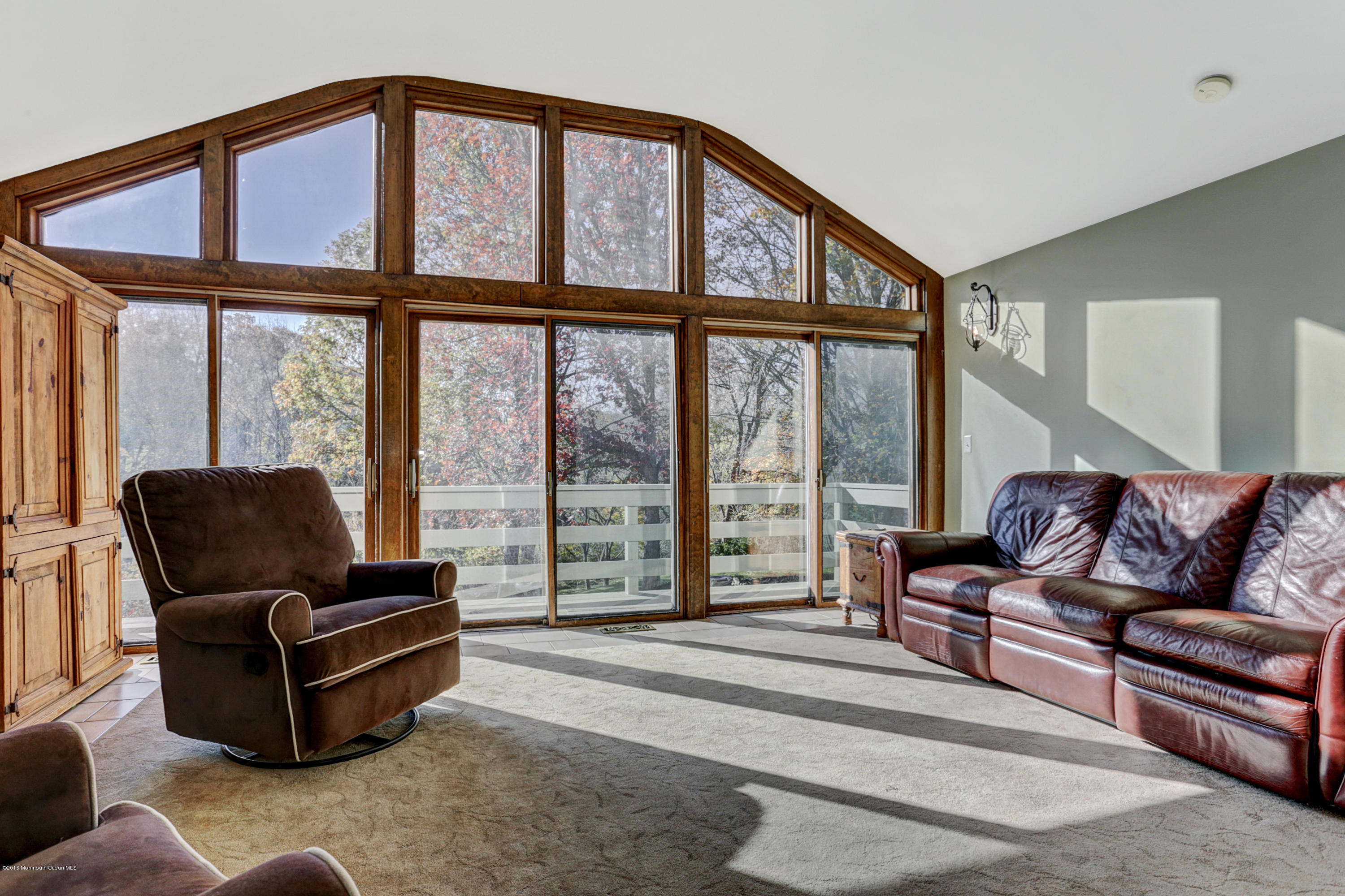 254 Newman Springs Road Colts Neck, NJ 07722 - Photo 12 of 30 a living room with furniture and large windows