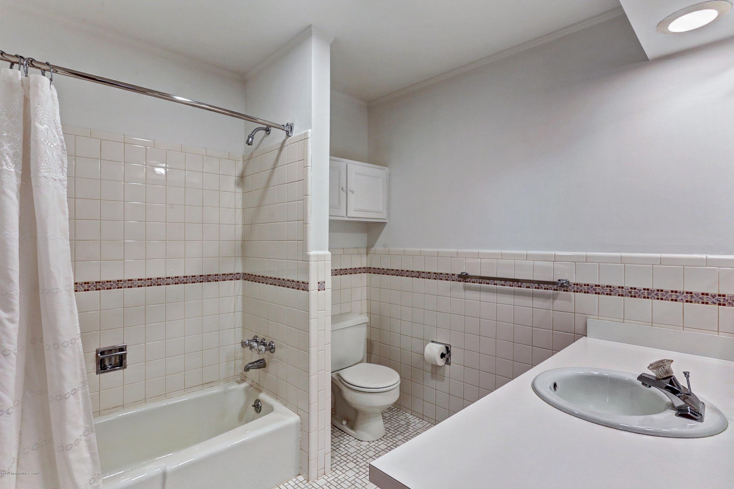 254 Newman Springs Road Colts Neck, NJ 07722 - Photo 14 of 30 a bathroom with a sink toilet and shower