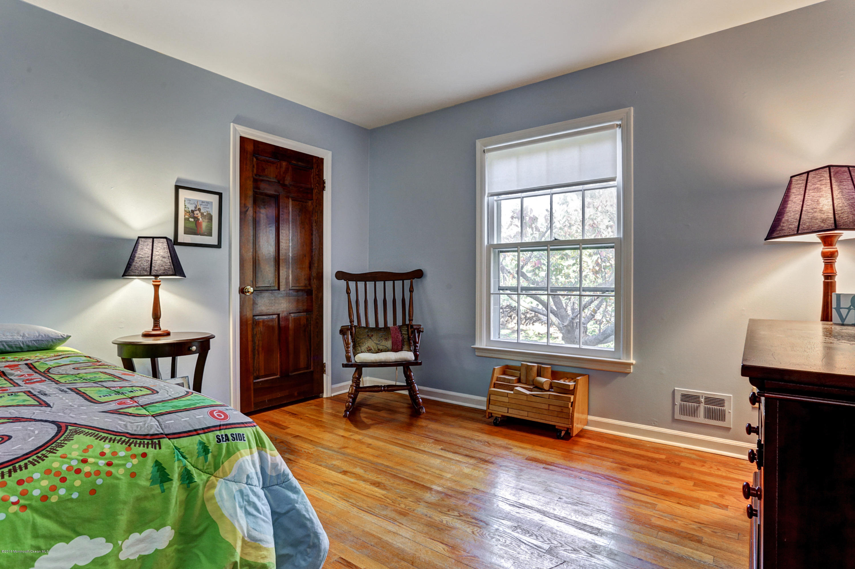 254 Newman Springs Road Colts Neck, NJ 07722 - Photo 17 of 30 a living room with furniture rug and wooden floor