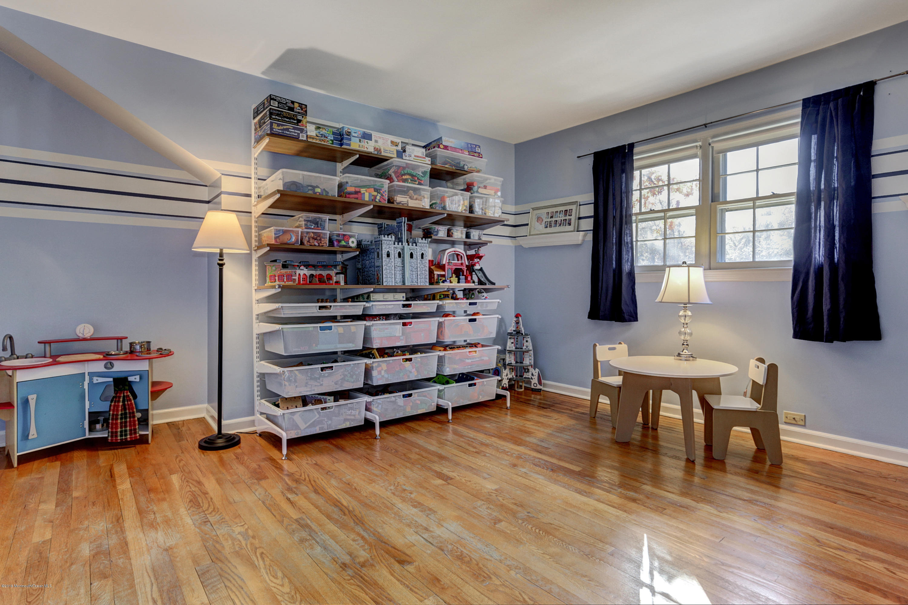 254 Newman Springs Road Colts Neck, NJ 07722 - Photo 21 of 30 a room with furniture and a wooden floor