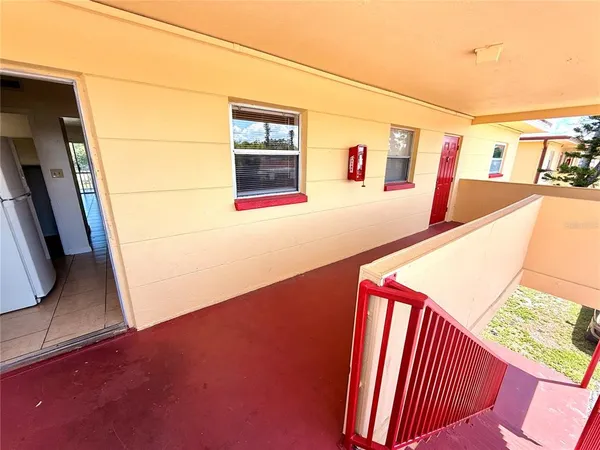 a view of an empty room with many windows