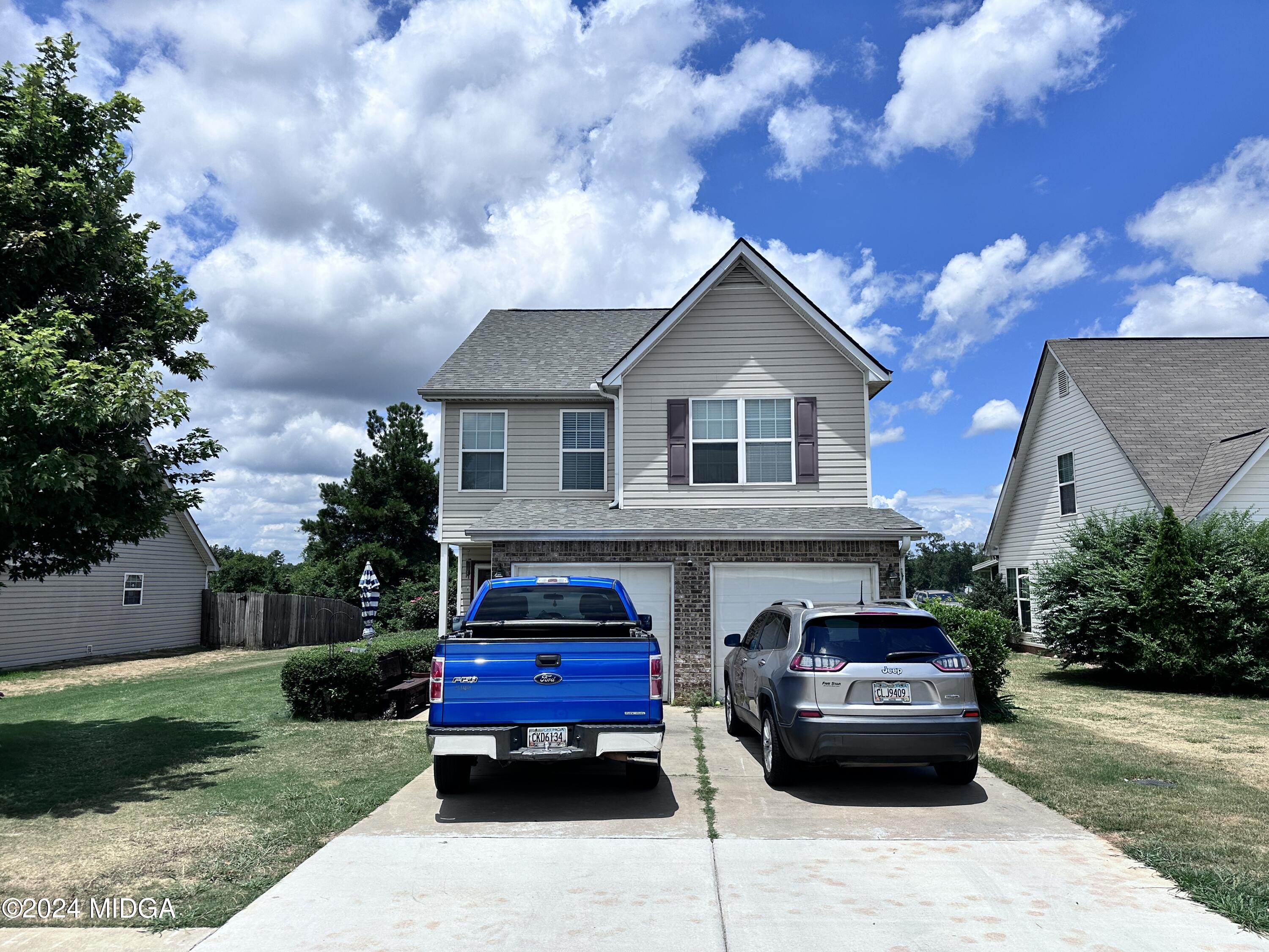 a house view with a garden space