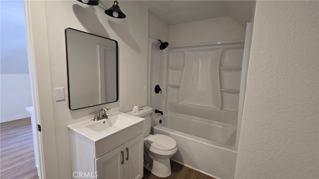 975 North Pk Circle, Unit B Long Beach, CA 90813 - Photo 9 of 9 a bathroom with a toilet sink shower and mirror