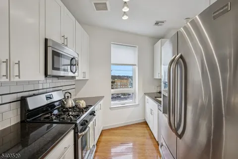 a bedroom with a bed and a mirror