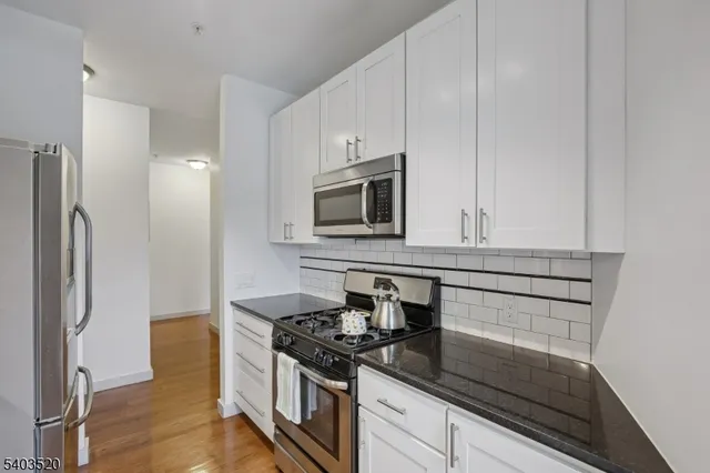 a living room with furniture window and wooden floor