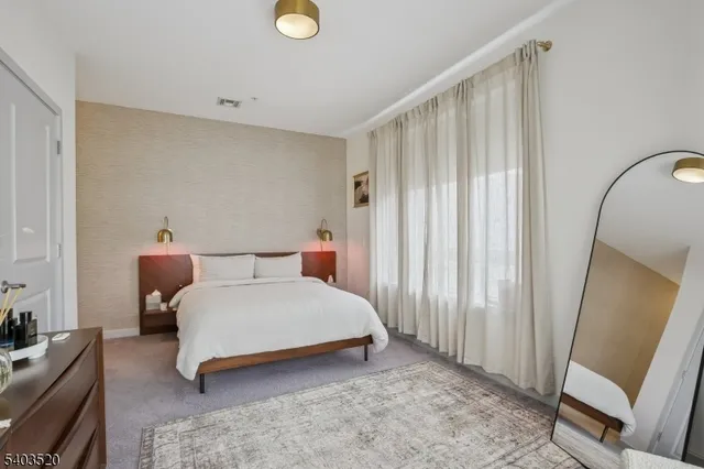 a view of a balcony with two chairs and a table