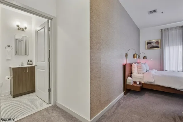 a bedroom with a bed and a couch