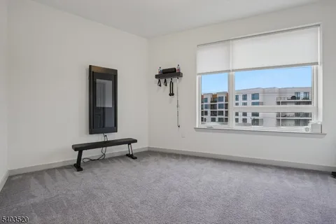 a view of a bedroom with washer and dryer