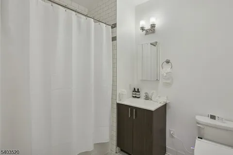 a view of a hallway with a potted plant