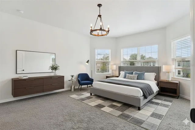 a spacious bedroom with a bed and a window