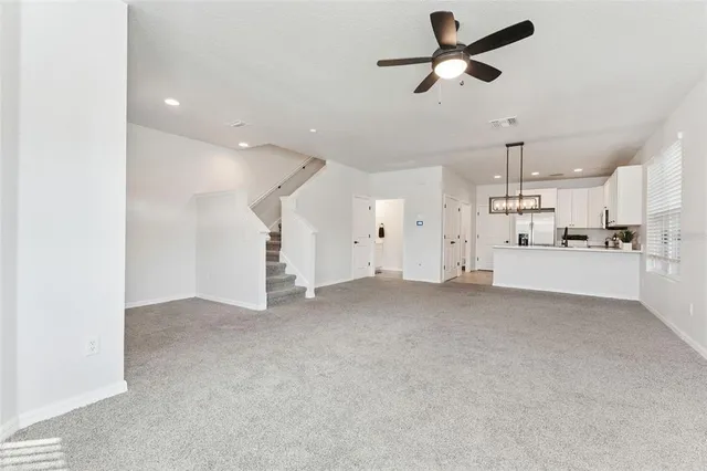 a view of a kitchen with a sink and cabinets