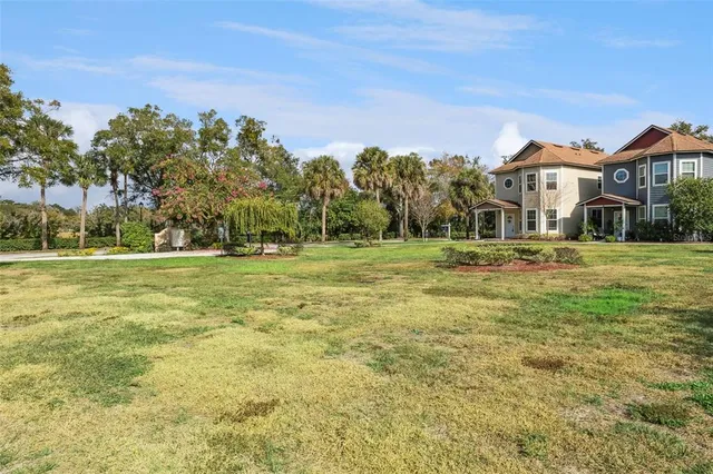 an aerial view of multiple houses with yard