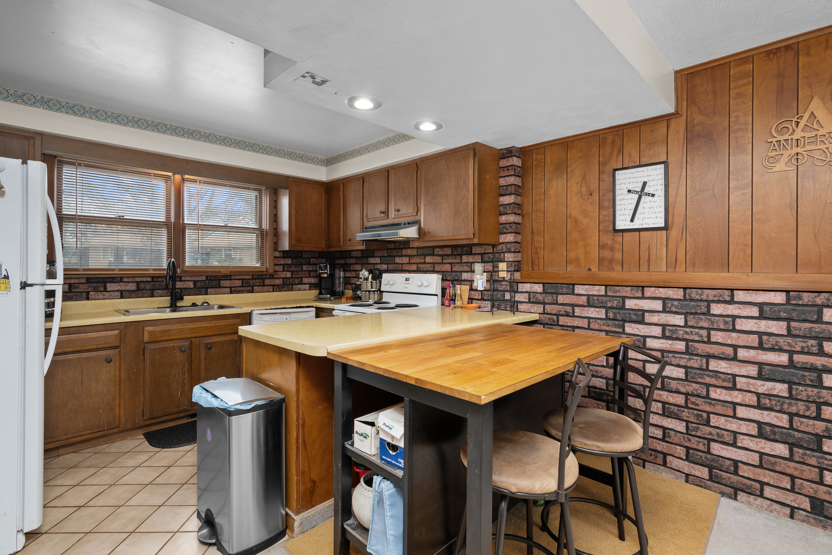 3604 32nd Avenue Moline, IL 61265 - Photo 11 of 36 a kitchen with a sink cabinets and window