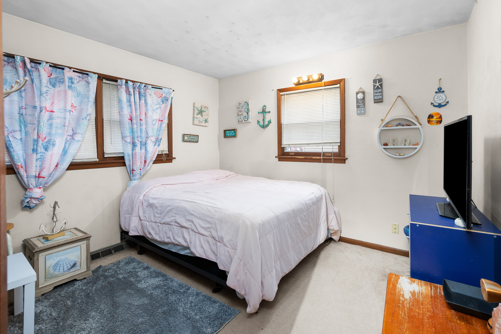 3604 32nd Avenue Moline, IL 61265 - Photo 19 of 36 a bedroom with a bed and a flat tv screen on dresser