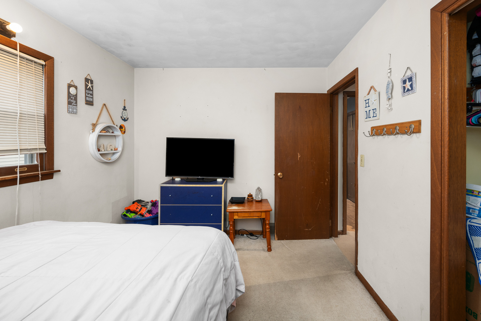3604 32nd Avenue Moline, IL 61265 - Photo 20 of 36 a bedroom with a bed and a flat tv screen on wall