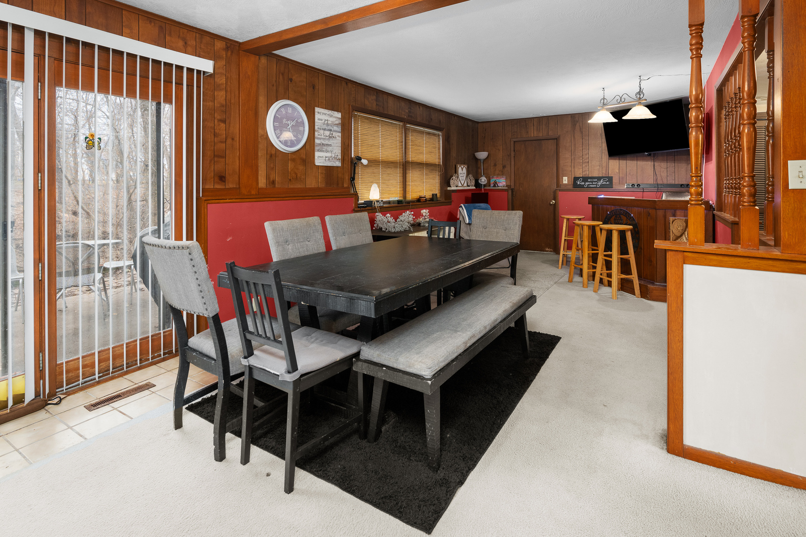 3604 32nd Avenue Moline, IL 61265 - Photo 26 of 36 a living room with furniture a flat screen tv and a table