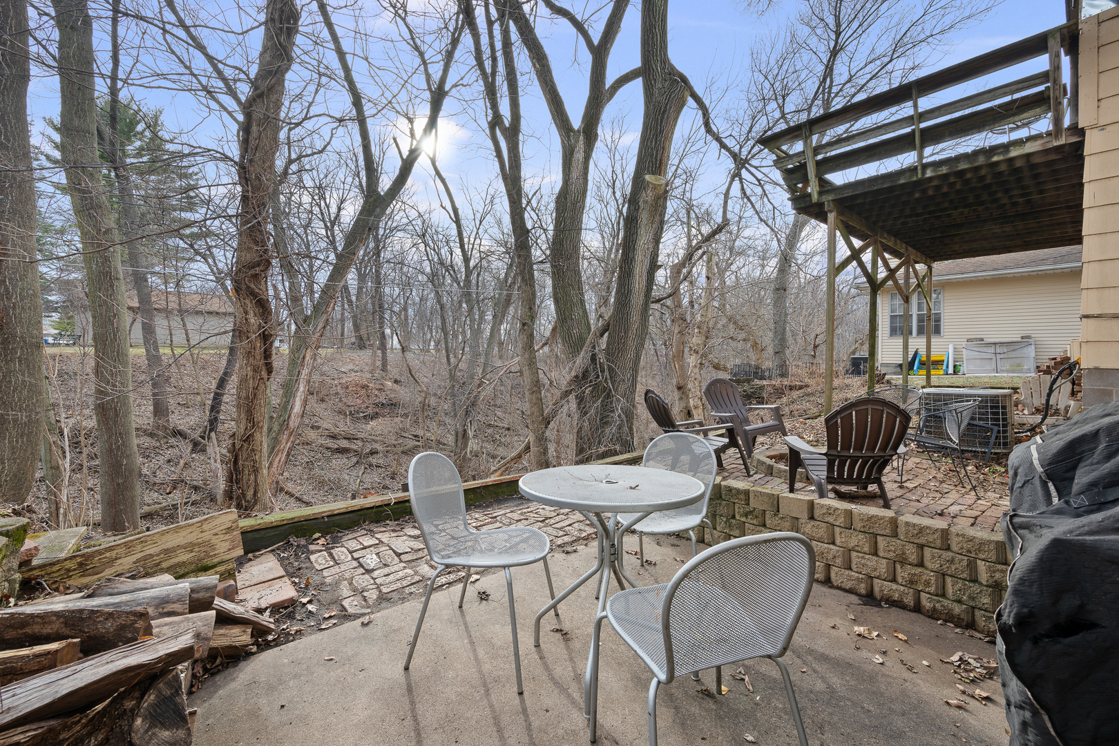 3604 32nd Avenue Moline, IL 61265 - Photo 35 of 36 a backyard of a house with barbeque oven table and chairs
