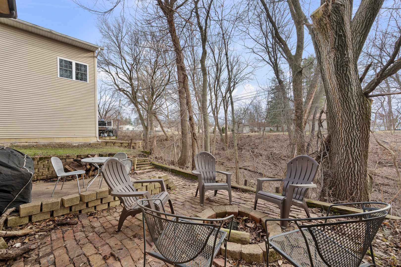 3604 32nd Avenue Moline, IL 61265 - Photo 36 of 36 a backyard of a house with barbeque oven table and chairs