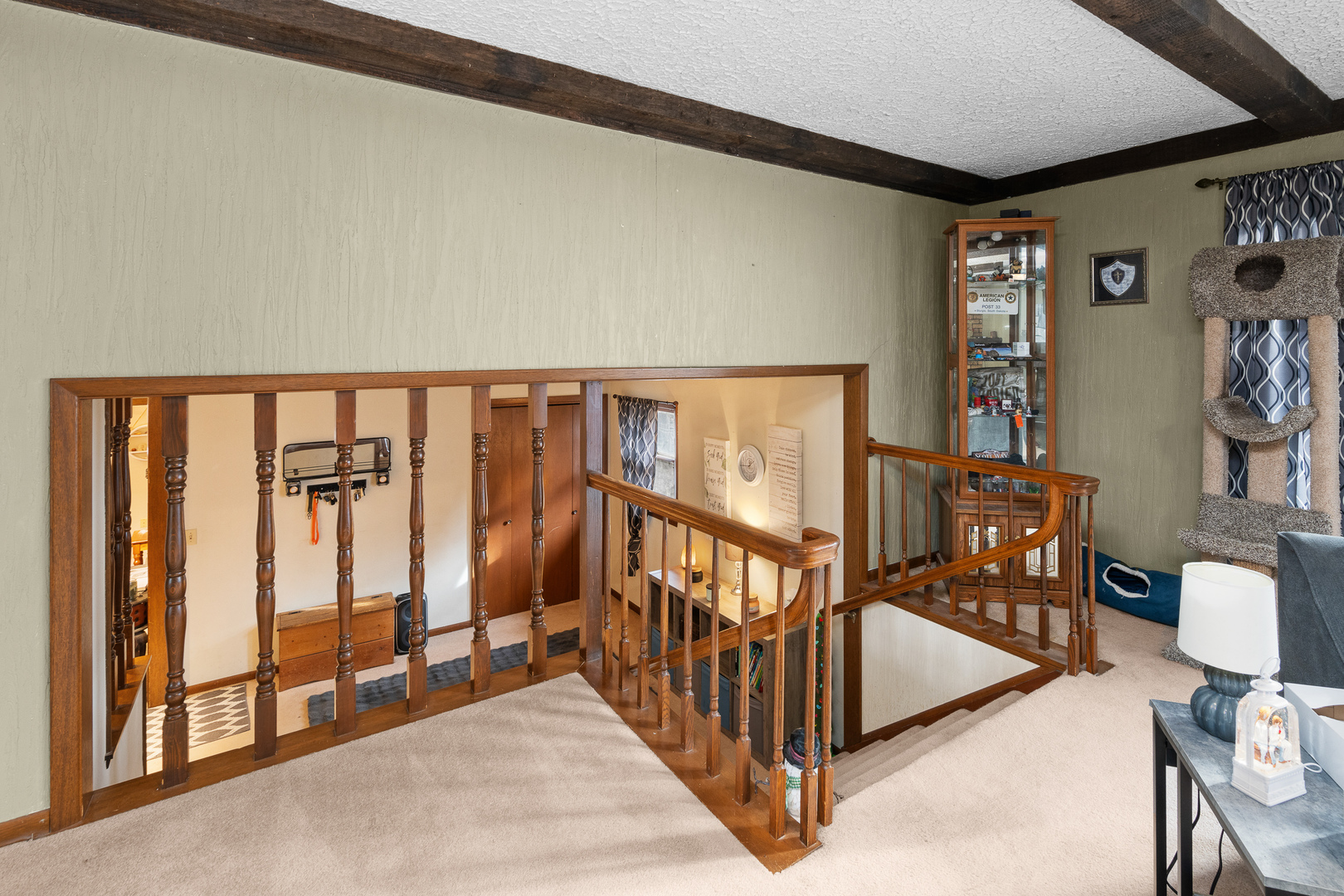 3604 32nd Avenue Moline, IL 61265 - Photo 4 of 36 a view of staircase with lots of frames on wall