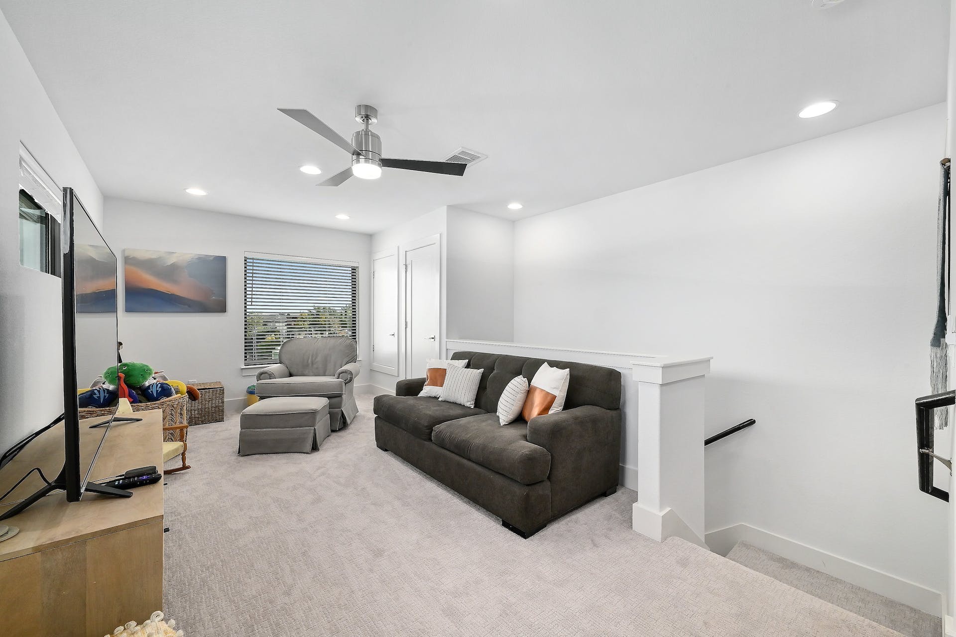 2050 Lohmans Spur Road, Unit 2301 Lakeway, TX 78734 - Photo 15 of 27 a living room with furniture and a ceiling fan