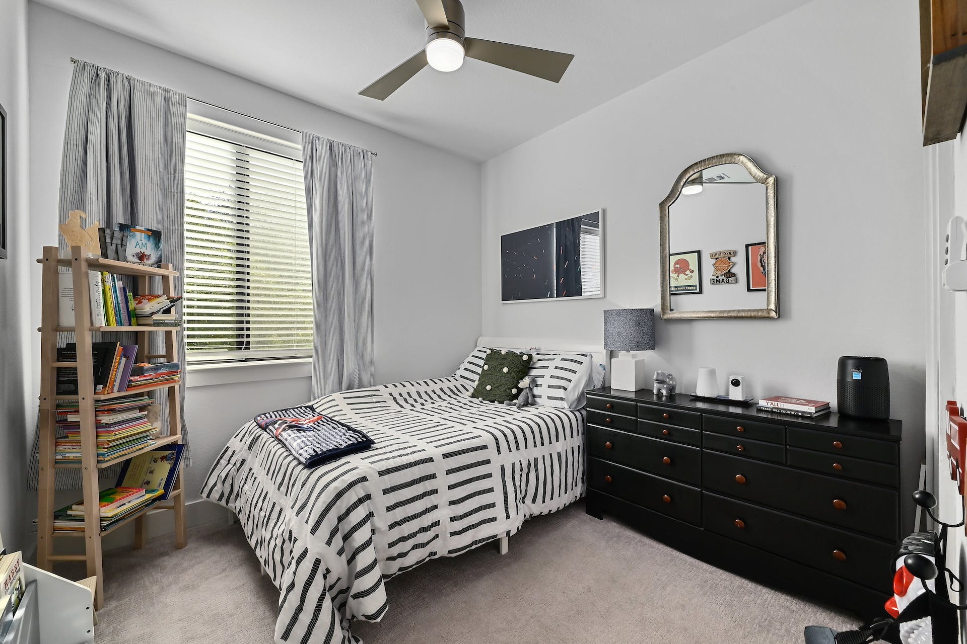 2050 Lohmans Spur Road, Unit 2301 Lakeway, TX 78734 - Photo 18 of 27 a bedroom with a bed and a television