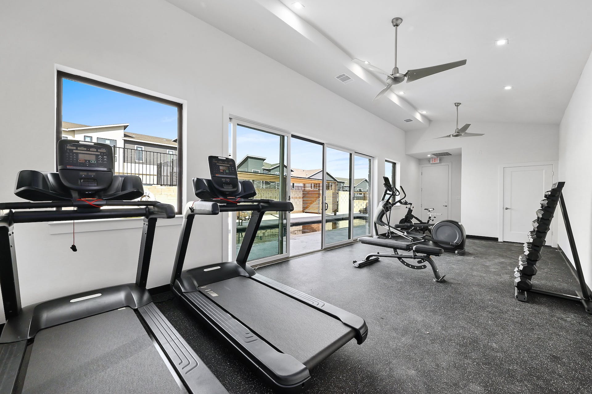 2050 Lohmans Spur Road, Unit 2301 Lakeway, TX 78734 - Photo 23 of 27 a room with gym equipment and a large window