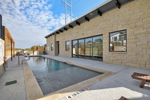 a view of swimming pool with outdoor seating