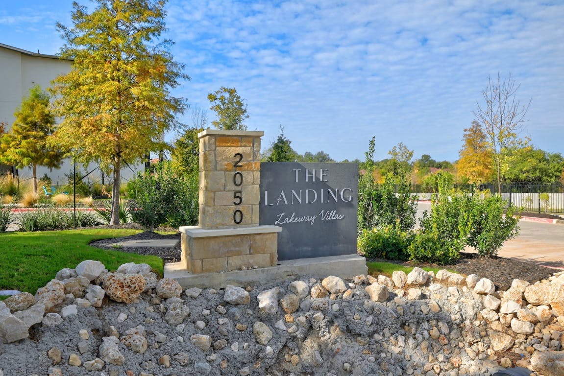 2050 Lohmans Spur Road, Unit 2301 Lakeway, TX 78734 - Photo 25 of 27 View of community sign