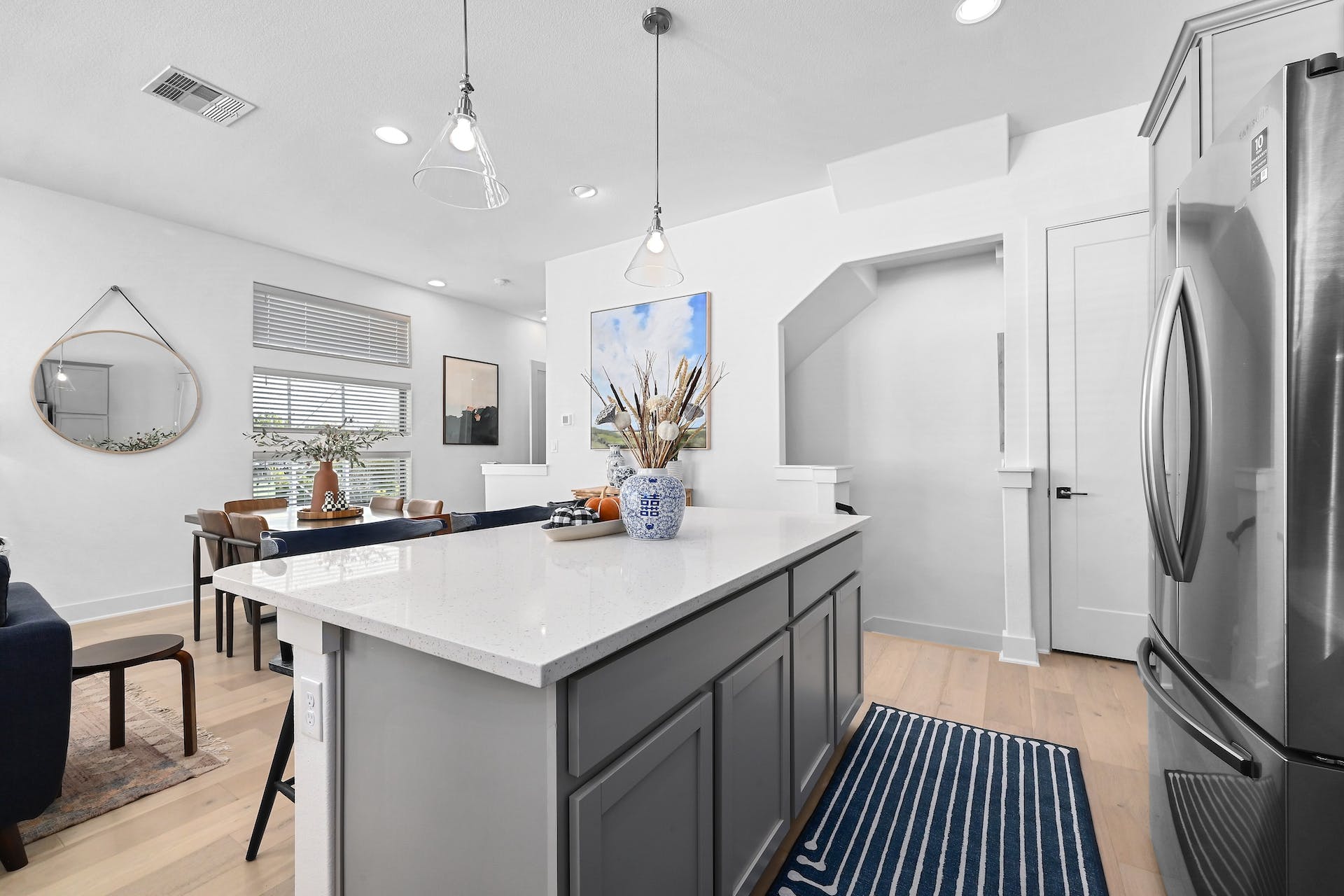 2050 Lohmans Spur Road, Unit 2301 Lakeway, TX 78734 - Photo 9 of 27 a kitchen with kitchen island a sink stove and refrigerator