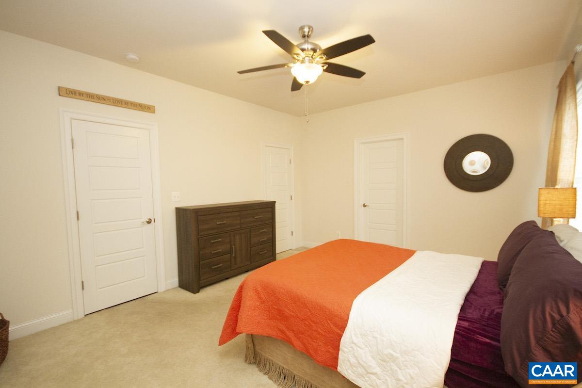 2307 Avinity Court Charlottesville, VA 22902 - Photo 11 of 35 a bedroom with a bed and cabinets