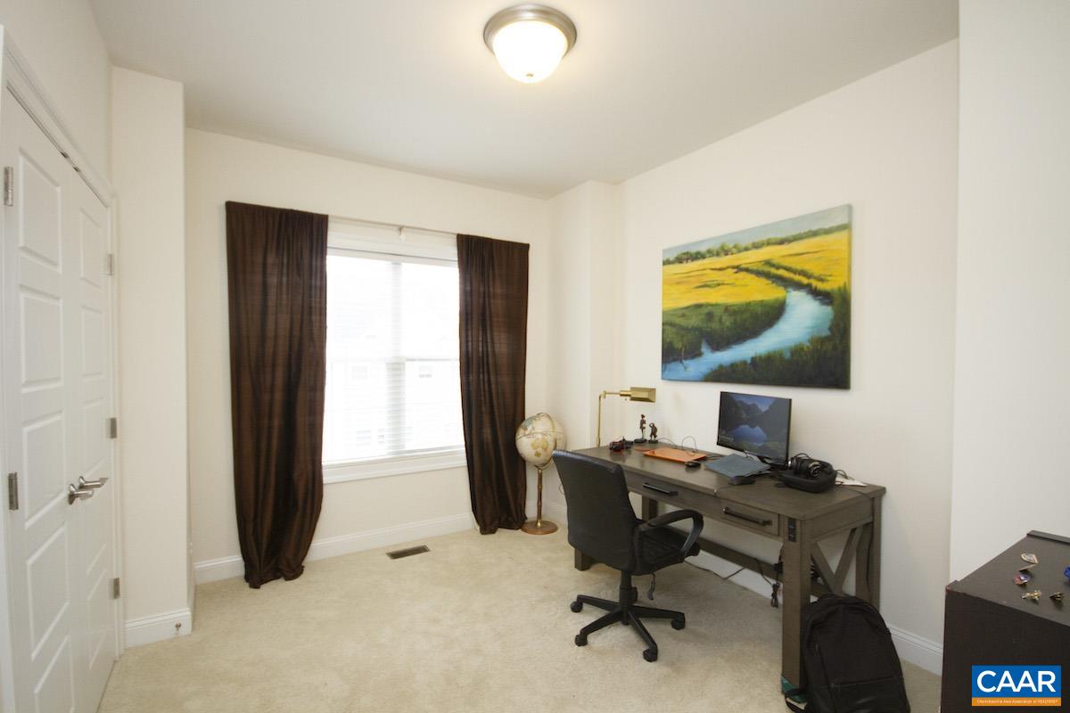 2307 Avinity Court Charlottesville, VA 22902 - Photo 15 of 35 a view of a workspace with furniture and a window