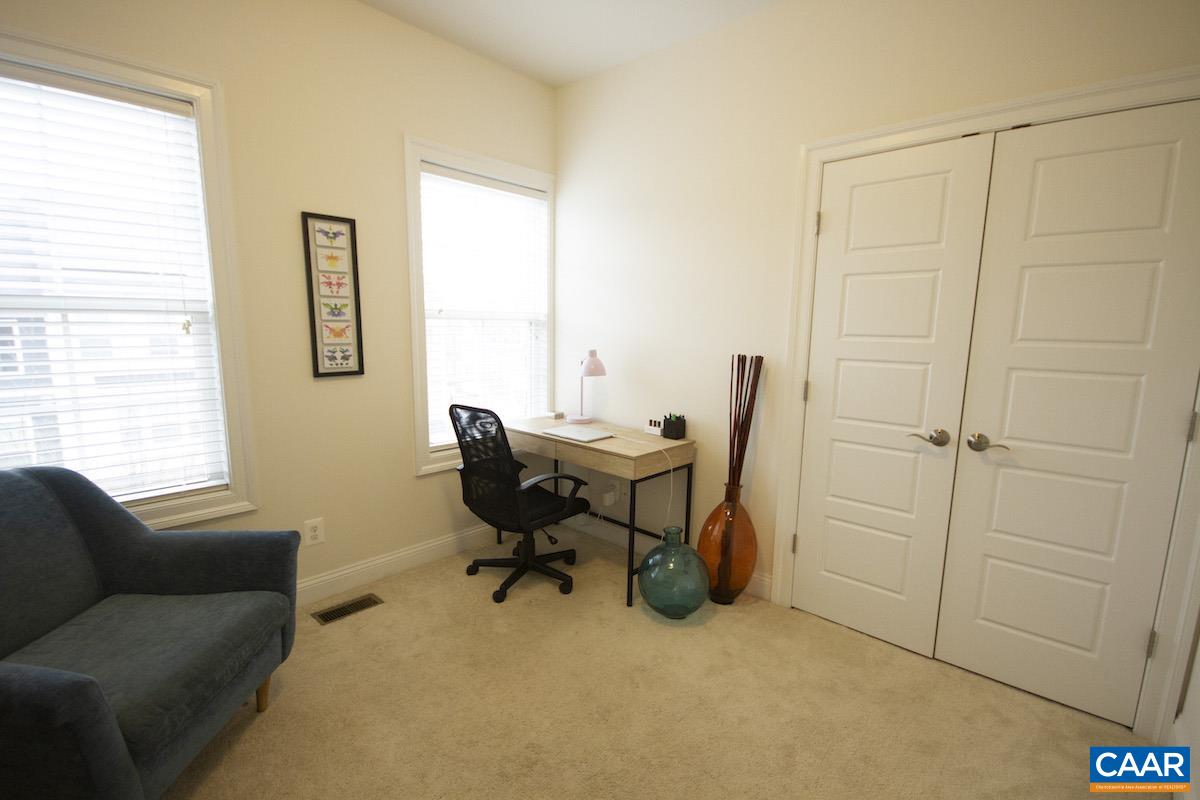 2307 Avinity Court Charlottesville, VA 22902 - Photo 17 of 35 a view of a livingroom with workspace and a couch