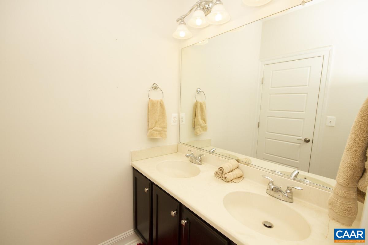 2307 Avinity Court Charlottesville, VA 22902 - Photo 18 of 35 a bathroom with a sink and a mirror