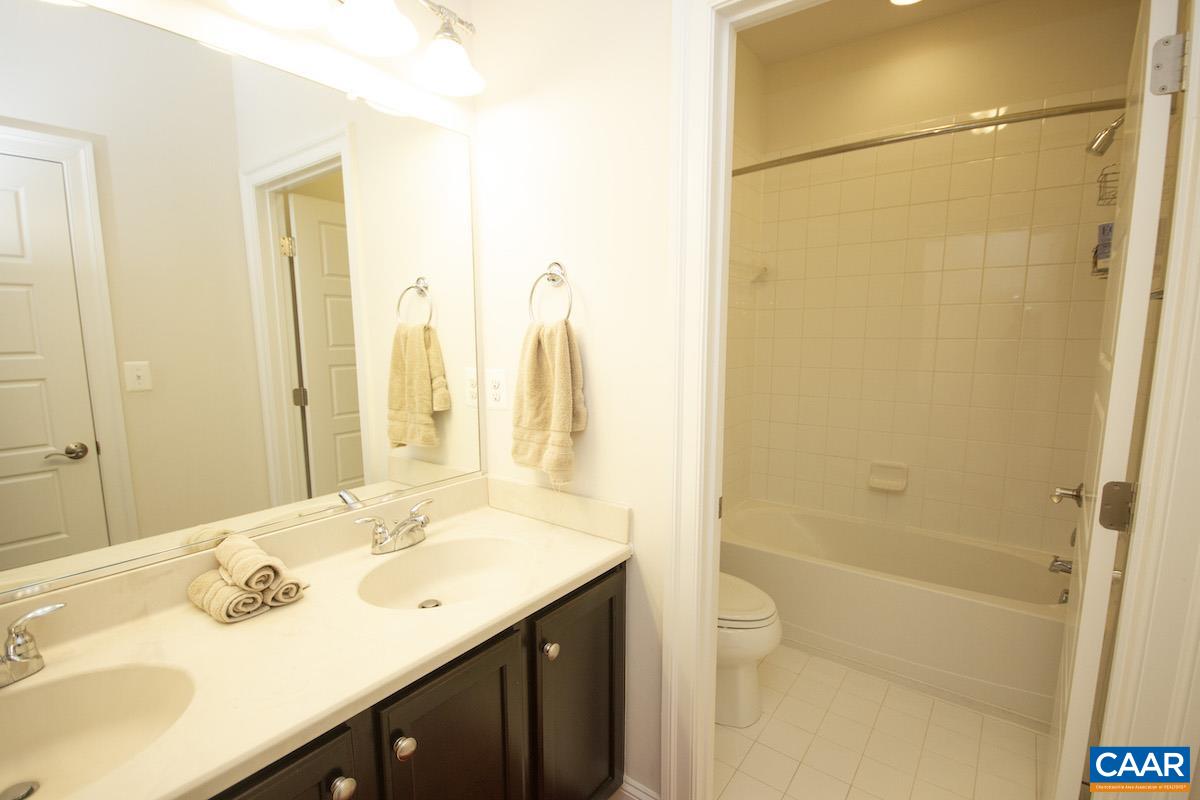 2307 Avinity Court Charlottesville, VA 22902 - Photo 19 of 35 a bathroom with a sink and a mirror