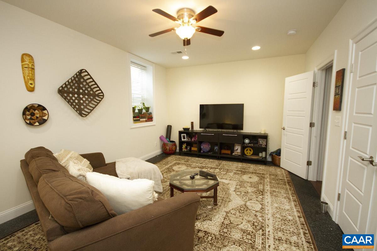 2307 Avinity Court Charlottesville, VA 22902 - Photo 22 of 35 a living room with furniture and a flat screen tv