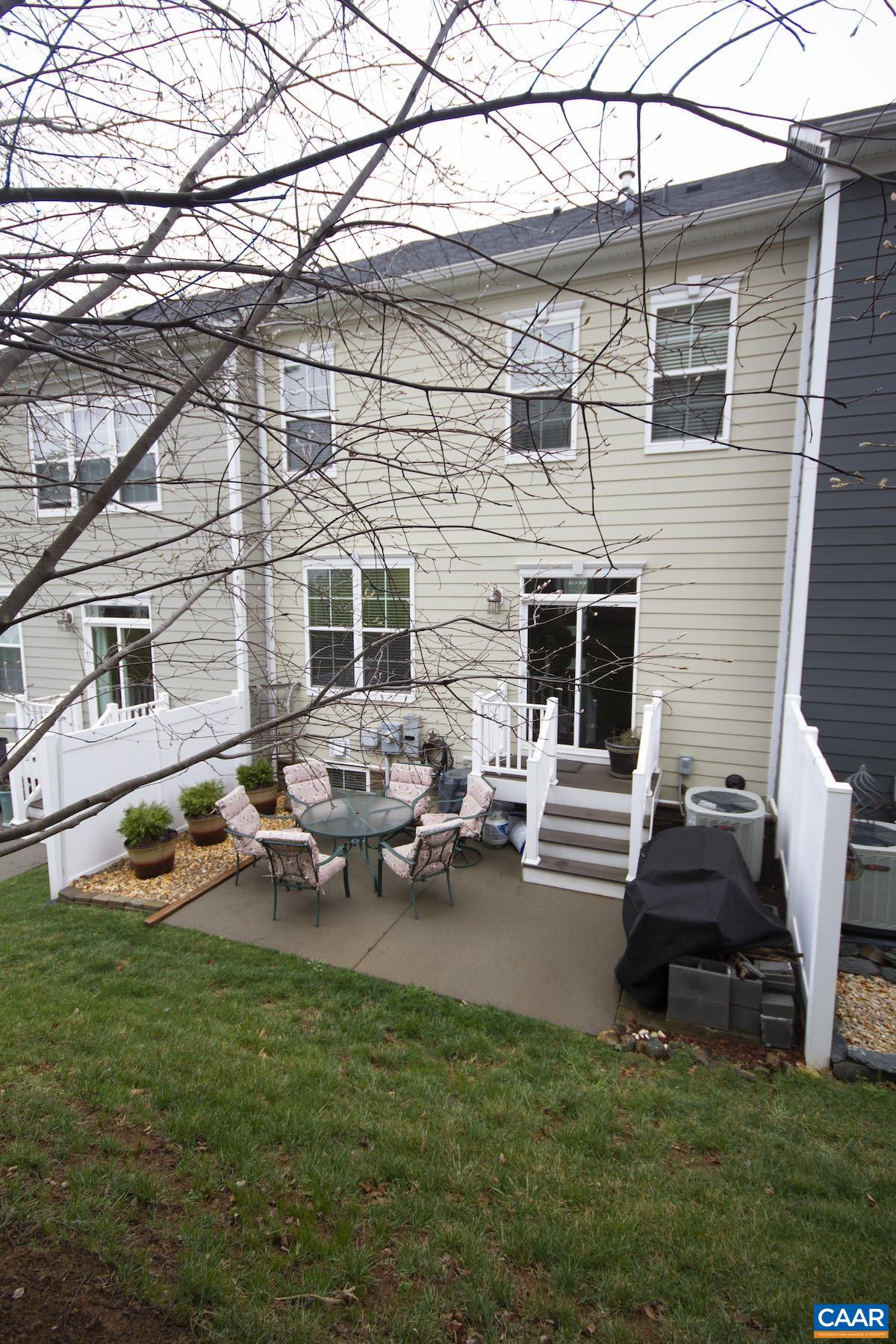 2307 Avinity Court Charlottesville, VA 22902 - Photo 23 of 35 a backyard of a house with fire pit and chairs