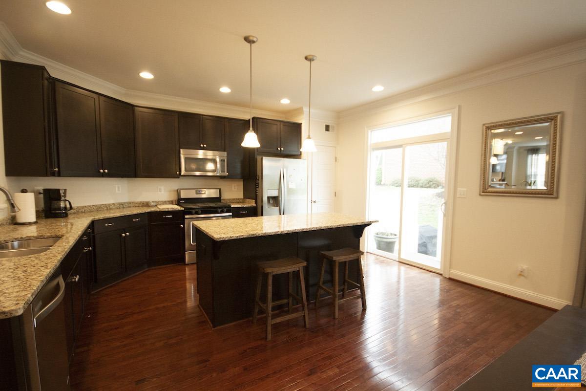 2307 Avinity Court Charlottesville, VA 22902 - Photo 6 of 35 a kitchen with a sink cabinets and wooden floor