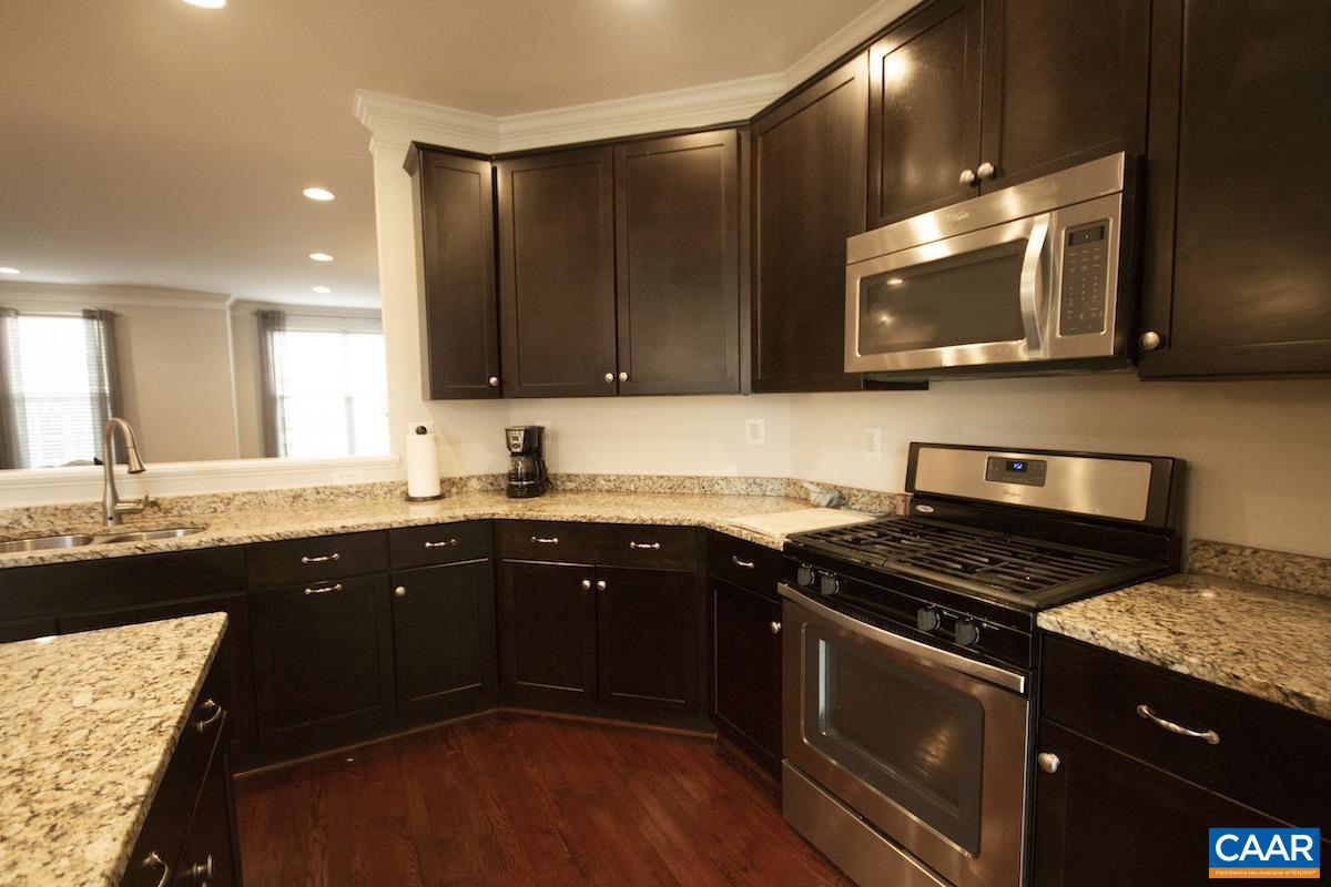 2307 Avinity Court Charlottesville, VA 22902 - Photo 8 of 35 a kitchen with a sink stove and microwave