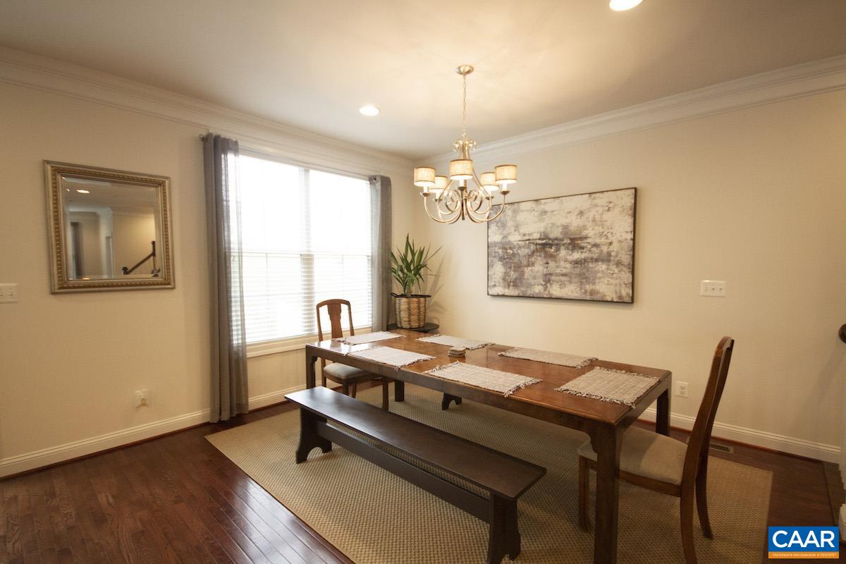 2307 Avinity Court Charlottesville, VA 22902 - Photo 9 of 35 a dining room with wooden floor and large window