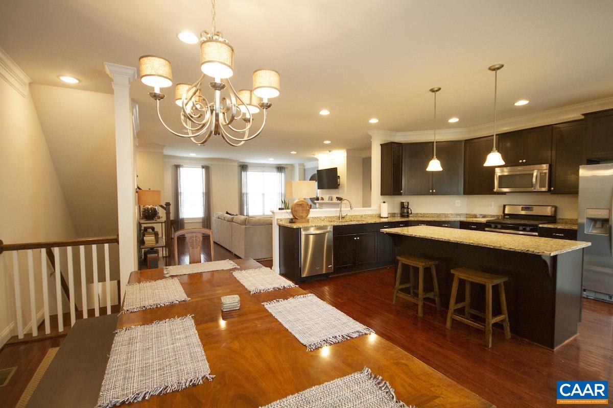 2307 Avinity Court Charlottesville, VA 22902 - Photo 10 of 35 a large kitchen with a large center island in the center