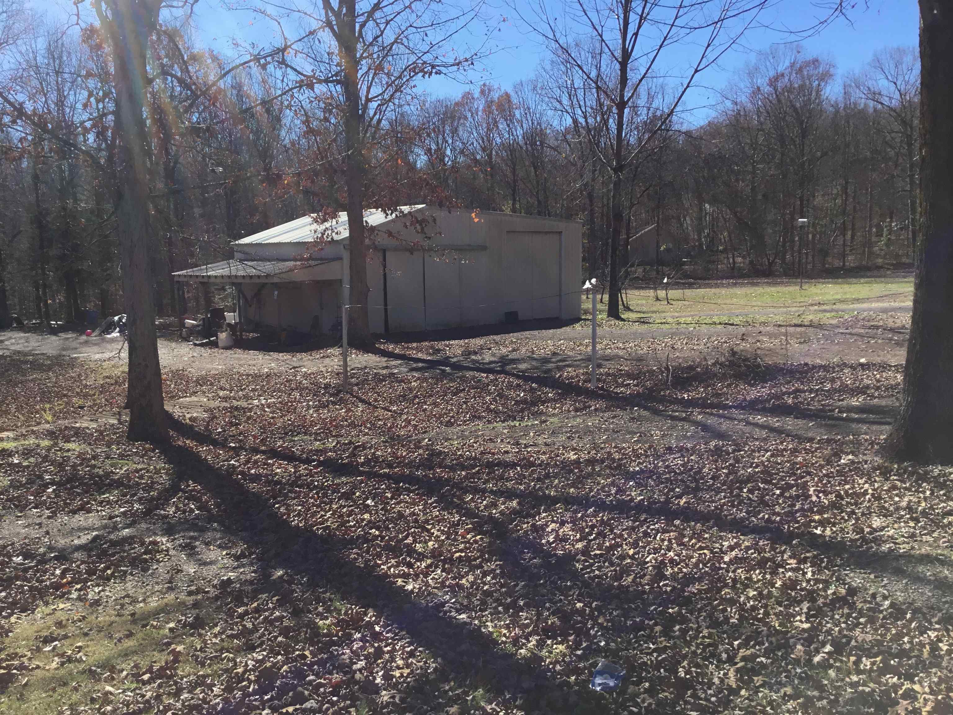 367 Crabtree Road Selmer, TN 38375 - Photo 23 of 23 a backyard of a house with trees and swing