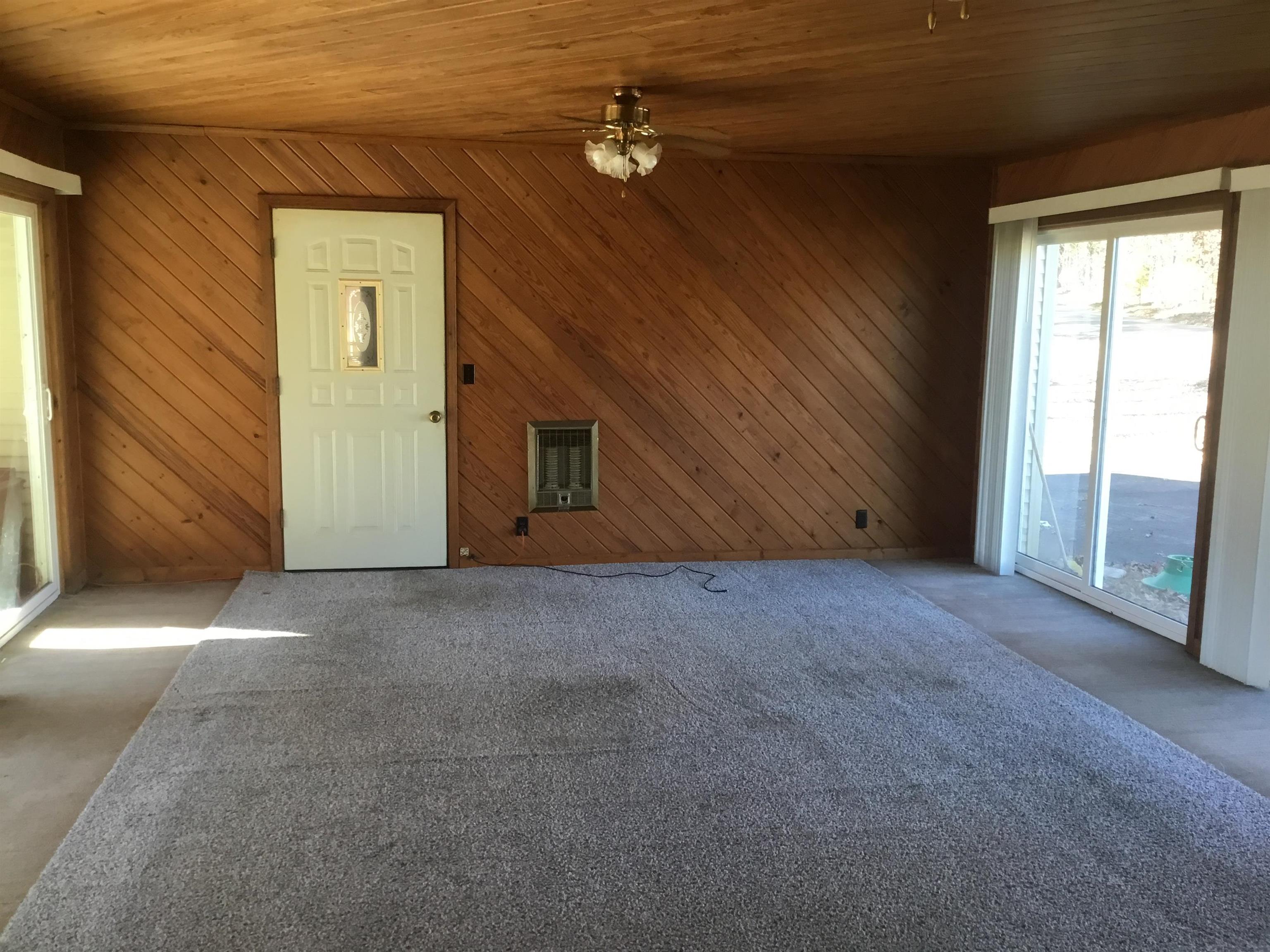 367 Crabtree Road Selmer, TN 38375 - Photo 5 of 23 a view of a livingroom with a ceiling fan and window