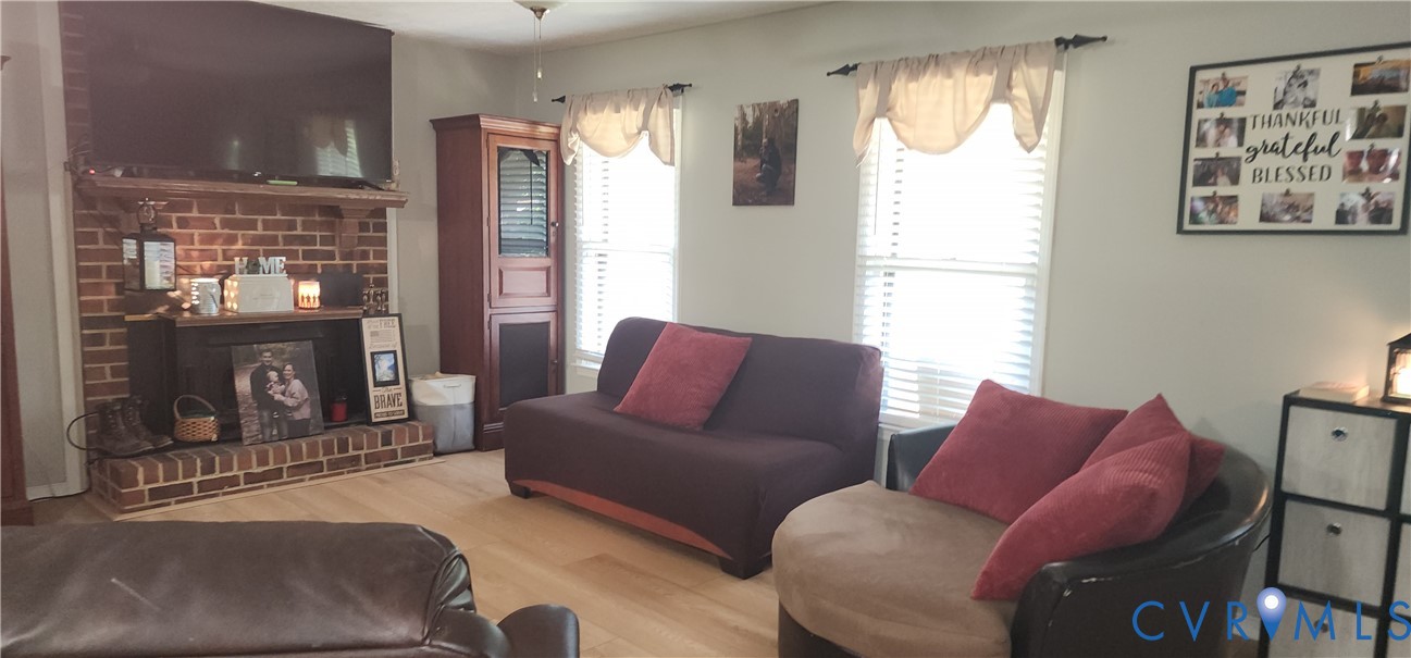 3170 Ella Road Henrico, VA 23231 - Photo 21 of 50 Living area featuring a brick fireplace, wood mant