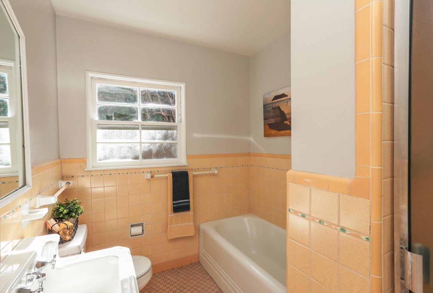 2160 Middlefield Road Palo Alto, CA 94301 - Photo 14 of 24 a bathroom with a bathtub toilet and window